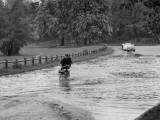 Suite ? un gros orage, un solex avance p?niblement sur la chauss?e inond?e ? Paris en France, le 5 mai 1969. (Photo by KEYSTONE-FRANCE/Gamma-Rapho via Getty Images)